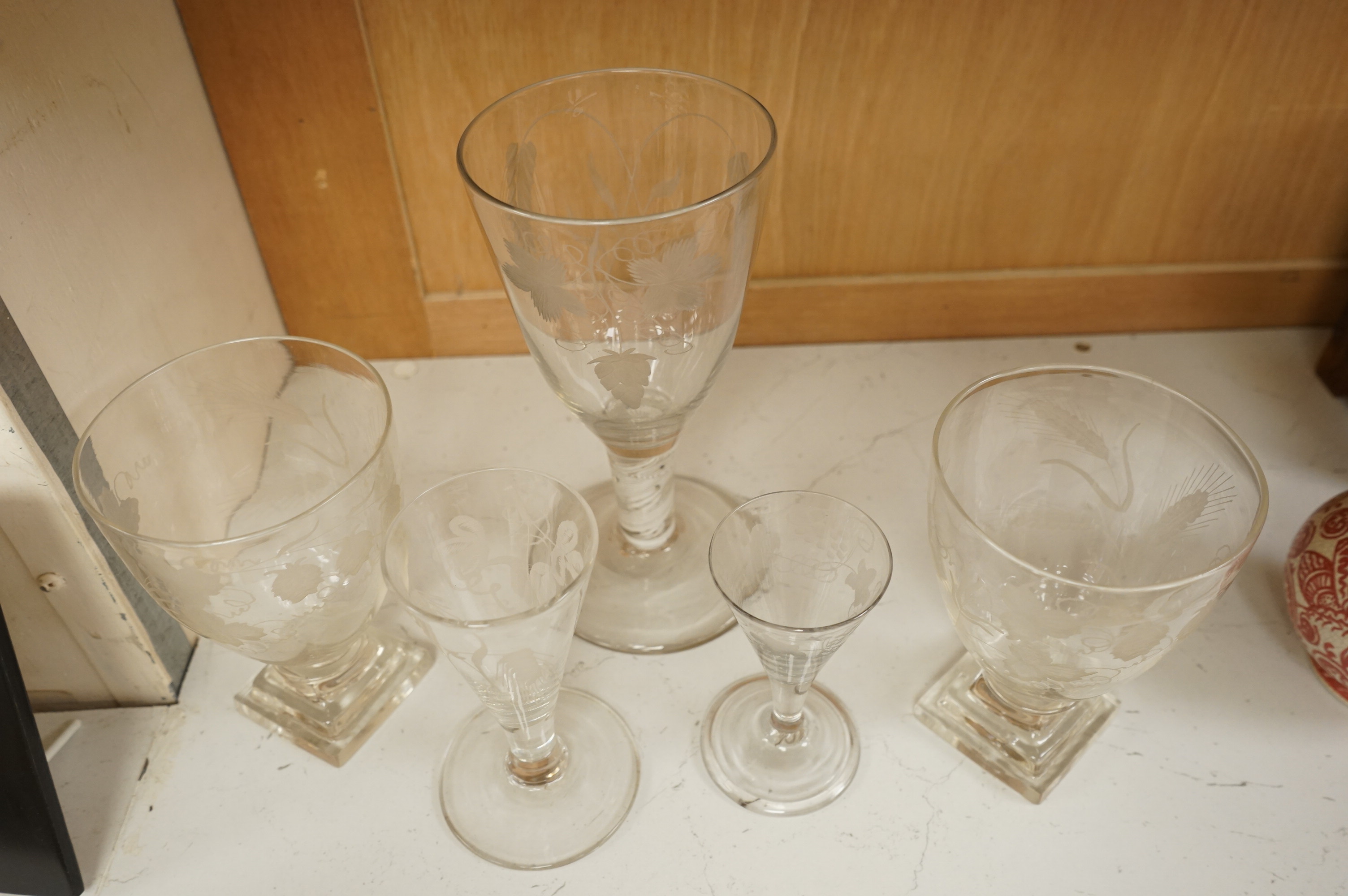 A group of 18th/early 19th century ale glasses, including two rummers, a large DSOT stem glass and two smaller funnel shaped glasses, largest 21cm high (5)